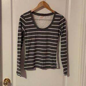 A long sleeve grey and white stripped shirt